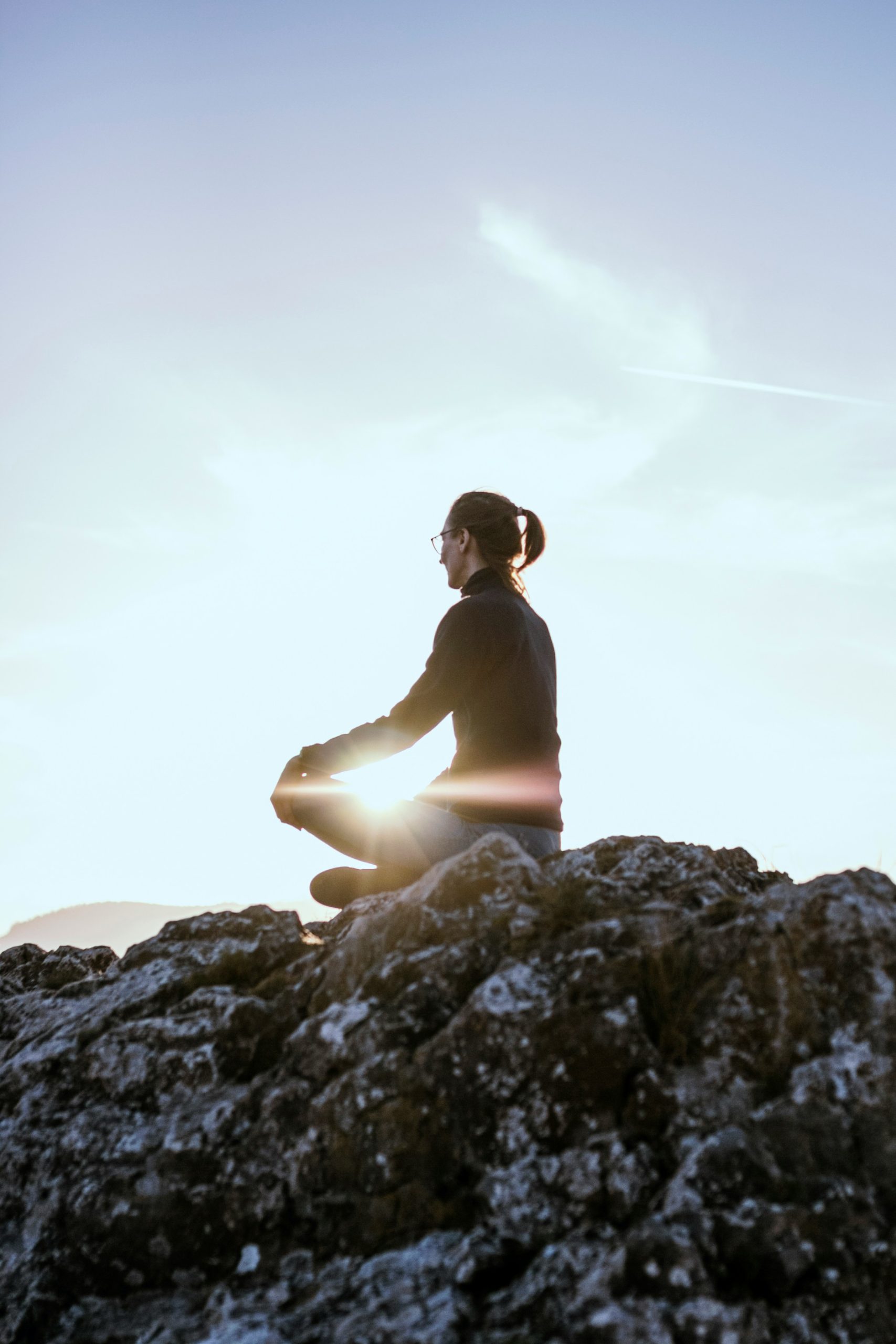 Woman relaxing peacefully — the calm, whole-person approach of homeopathy